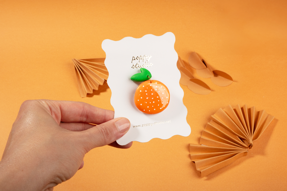 Orange brooche